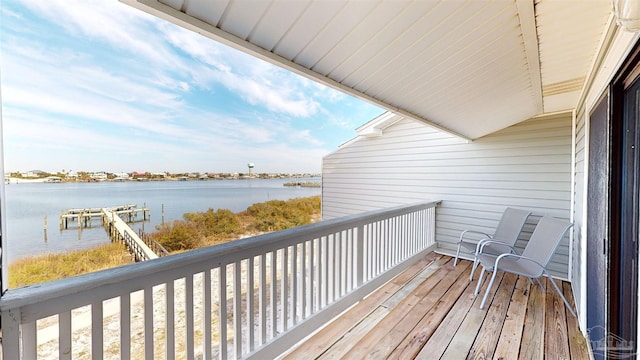 balcony featuring a water view