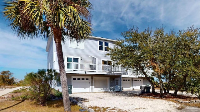 raised beach house with a garage