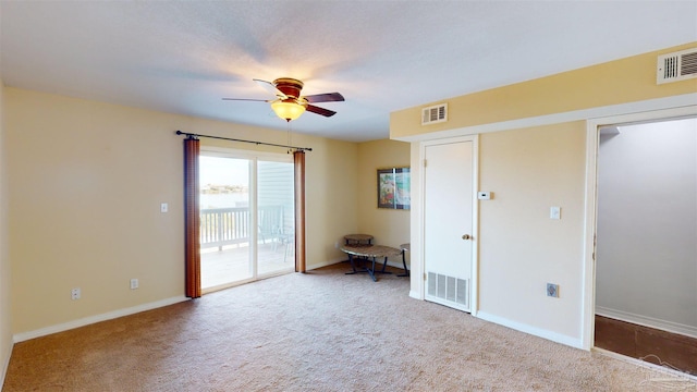 empty room with light carpet and ceiling fan