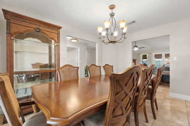 dining room with light tile patterned floors, visible vents, and baseboards