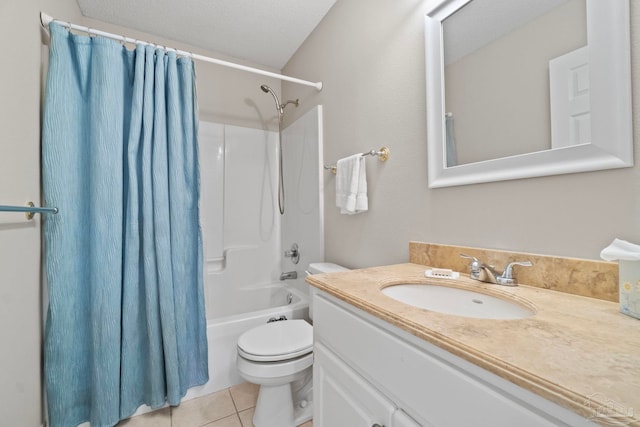 bathroom with a textured ceiling, toilet, vanity, tile patterned floors, and shower / bath combination with curtain