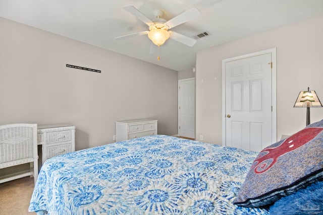 bedroom with ceiling fan, visible vents, and carpet flooring