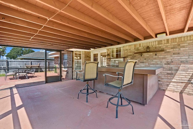 view of patio / terrace featuring fence