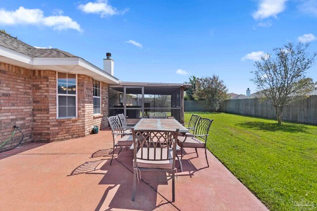 view of patio / terrace with a fenced backyard, a shed, an outbuilding, and outdoor dining space