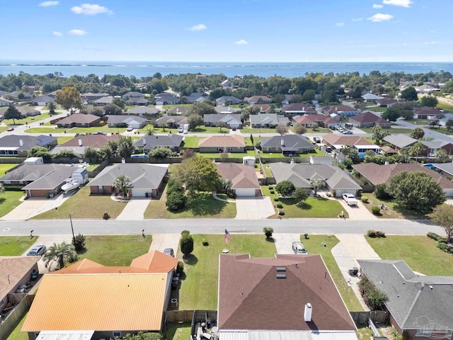 birds eye view of property with a residential view and a water view