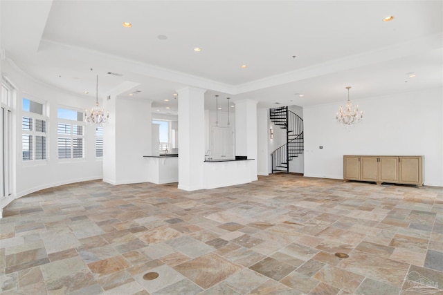 unfurnished living room featuring a notable chandelier and crown molding