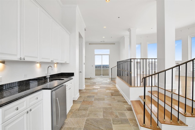 13555 Sandy Key Dr Ph, Ph, Perdido Key, FL 32507 - bar with baseboards, recessed lighting, dishwasher, a sink, and stone tile floors