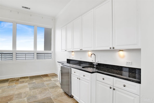 13555 Sandy Key Dr Ph, Ph, Perdido Key, FL 32507 - kitchen featuring fridge, stone finish flooring, a sink, baseboards, and visible vents