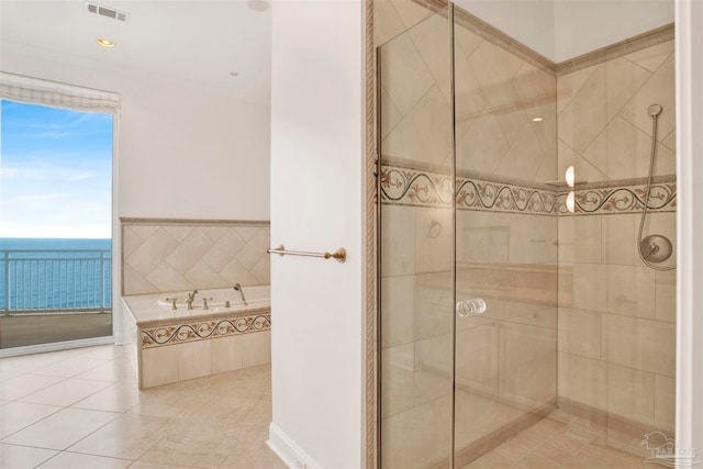 bathroom with a water view, separate shower and tub, and tile patterned flooring