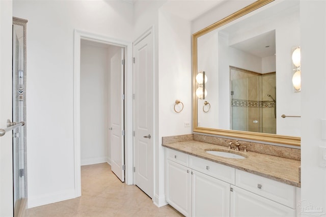 bathroom with tile patterned flooring, vanity, and a shower with shower door