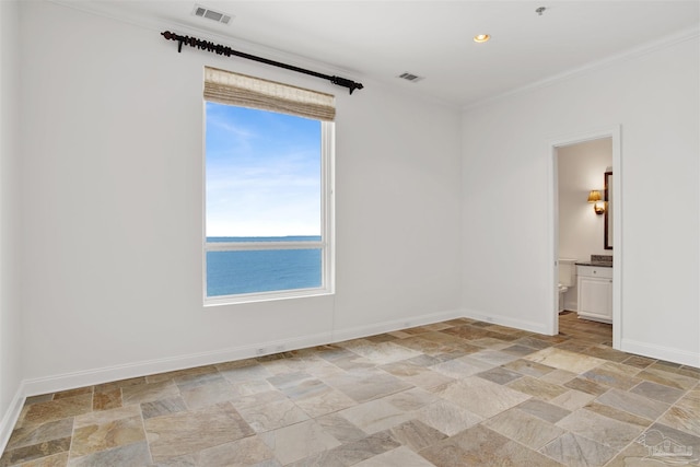 13555 Sandy Key Dr Ph, Ph, Perdido Key, FL 32507 - empty room featuring stone finish floor, visible vents, and ornamental molding