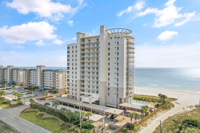 exterior space featuring a view of the beach and a water view