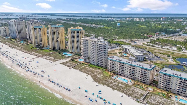 birds eye view of property with a view of the beach and a water view