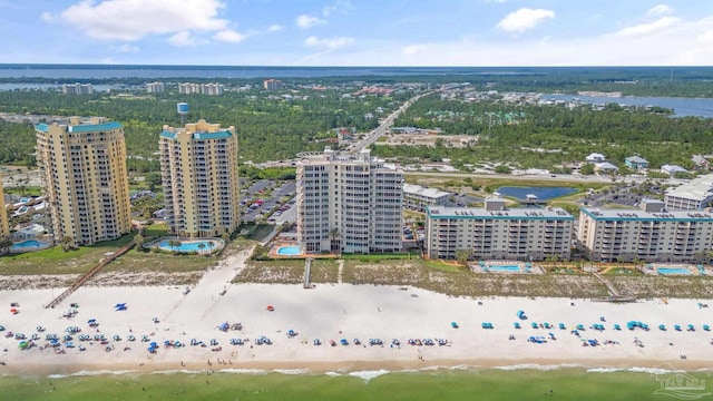 aerial view with a water view and a beach view