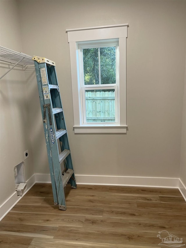 interior space featuring hardwood / wood-style flooring and hookup for an electric dryer