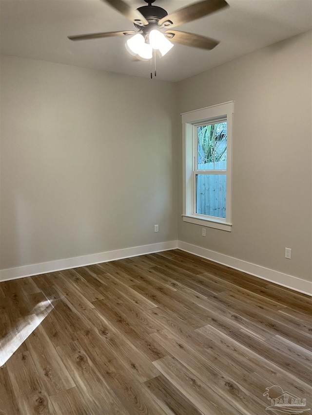 spare room featuring hardwood / wood-style flooring and ceiling fan