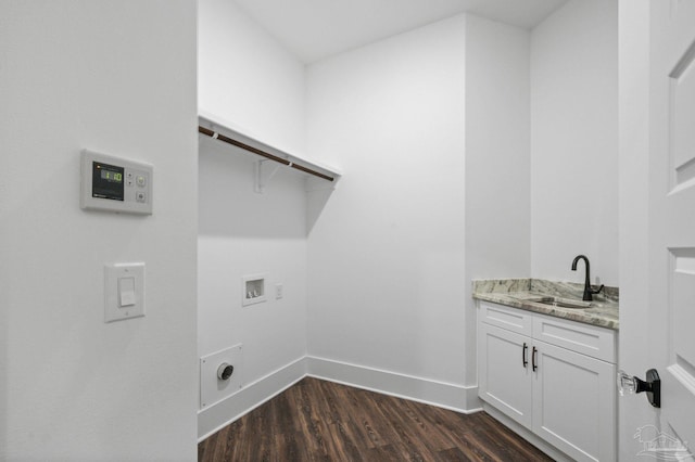 laundry area featuring baseboards, hookup for a washing machine, dark wood-style floors, cabinet space, and a sink