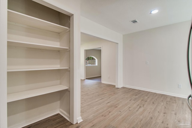 spare room with hardwood / wood-style flooring