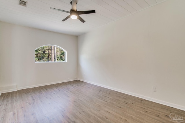 empty room featuring light hardwood / wood-style floors, ceiling fan, and wood ceiling