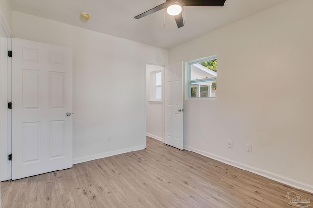 empty room featuring light hardwood / wood-style flooring and ceiling fan