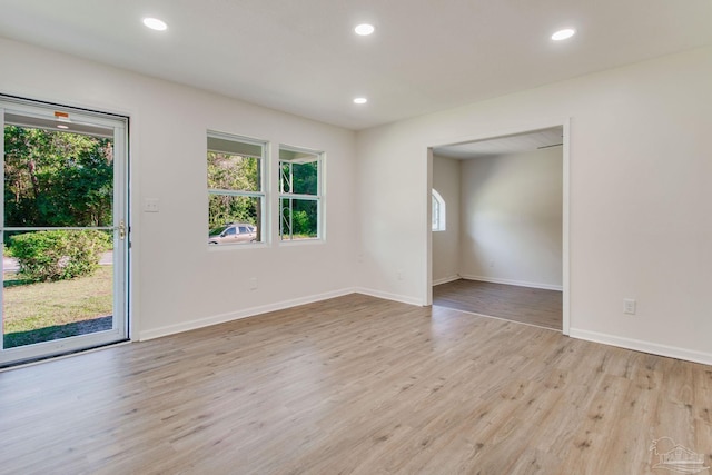 unfurnished room with light hardwood / wood-style flooring