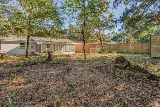 view of yard with a sunroom