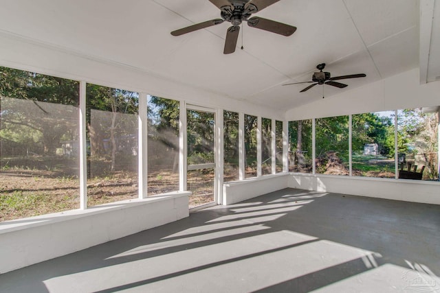 unfurnished sunroom with ceiling fan and lofted ceiling