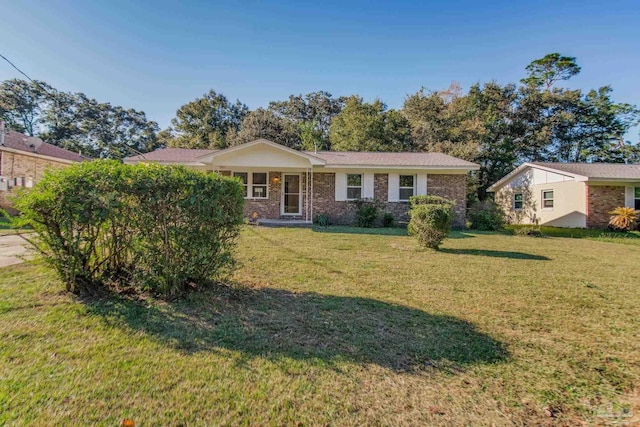 single story home with a front yard