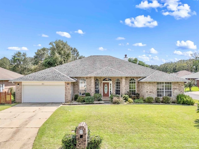 single story home with a front yard and a garage