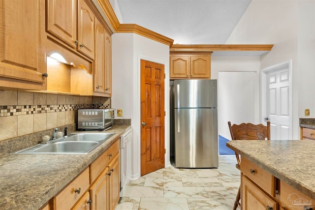 kitchen with lofted ceiling, dishwasher, backsplash, sink, and stainless steel fridge