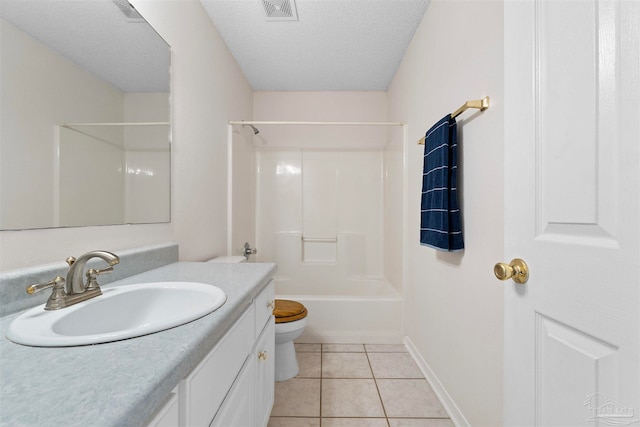 full bathroom with tile patterned floors, toilet, shower / bath combination, vanity, and a textured ceiling