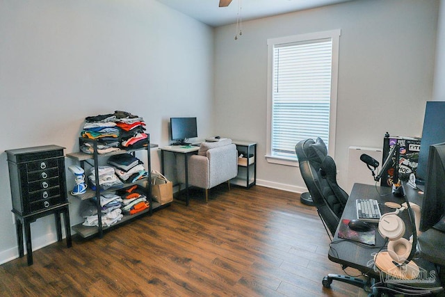 office area with ceiling fan and dark wood-type flooring