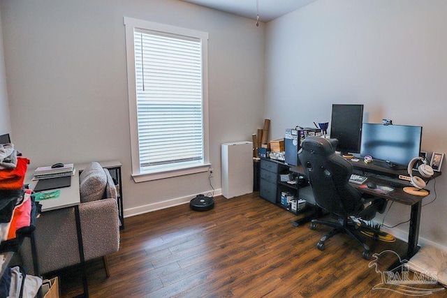 office with a wealth of natural light and dark wood-type flooring