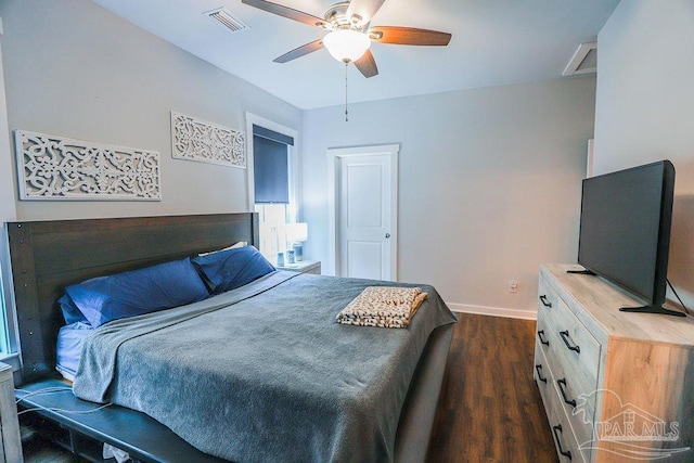 bedroom with ceiling fan and dark hardwood / wood-style flooring