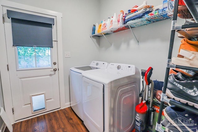 laundry area with dark wood-type flooring and washing machine and dryer