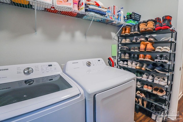 laundry room featuring washer and dryer and hardwood / wood-style floors