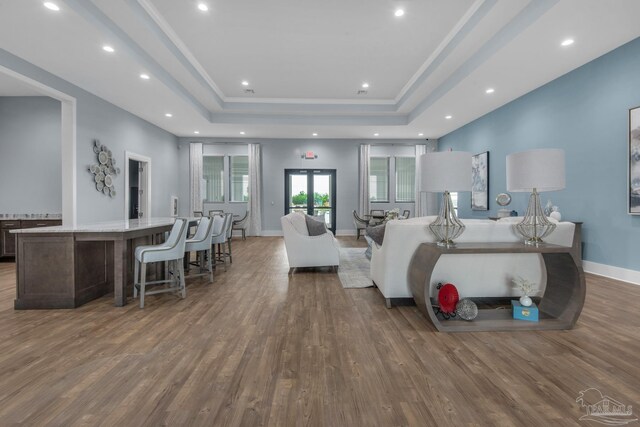 4704 Eider Rd, Pace, FL 32571 - bedroom featuring a tray ceiling, wood finished floors, recessed lighting, and baseboards