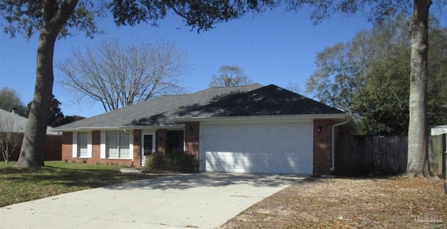 single story home featuring brick siding, an attached garage, fence, and driveway