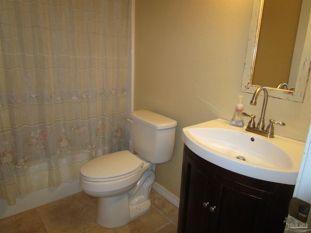 full bath featuring tile patterned flooring, vanity, and toilet