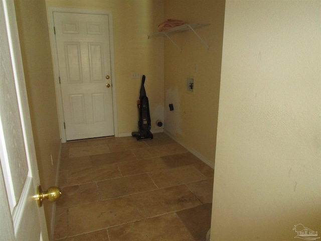 washroom with tile patterned flooring, laundry area, baseboards, and washer hookup