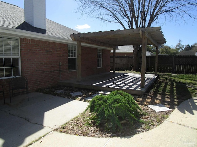 view of yard with fence, a patio, and a pergola