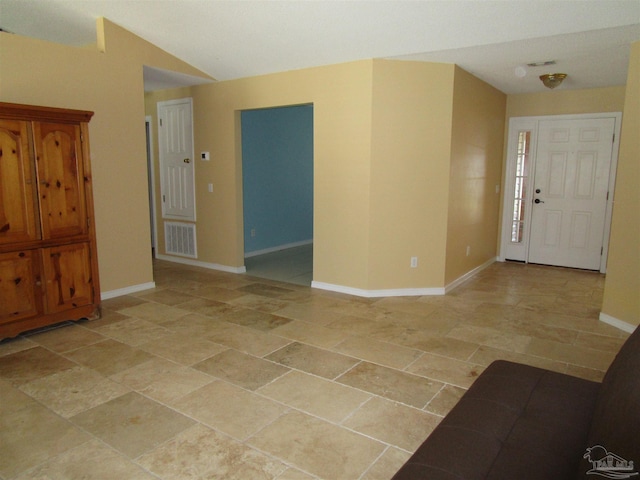 entrance foyer with baseboards and visible vents