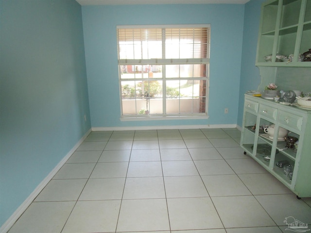 tiled spare room with baseboards