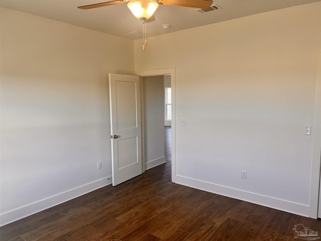 4420 Russell Elliott Rd, Jay, FL 32565 - unfurnished room with a ceiling fan, baseboards, dark wood-type flooring, and a smoke detector