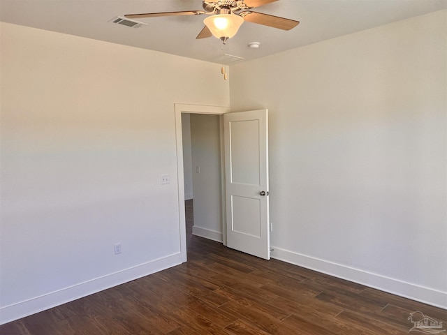 4420 Russell Elliott Rd, Jay, FL 32565 - empty room featuring a ceiling fan, dark wood-style flooring, baseboards, and a smoke detector