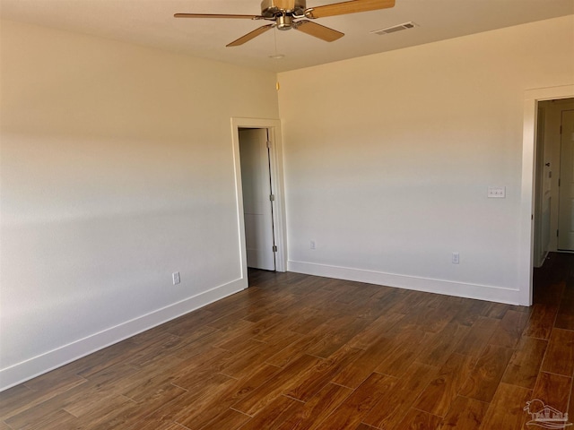 4420 Russell Elliott Rd, Jay, FL 32565 - empty room with dark wood-style flooring, ceiling fan, and baseboards