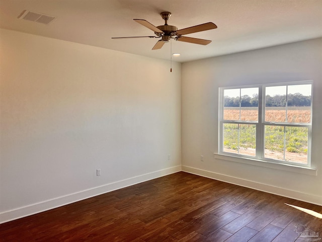 4420 Russell Elliott Rd, Jay, FL 32565 - spare room with baseboards, dark wood-style flooring, and ceiling fan