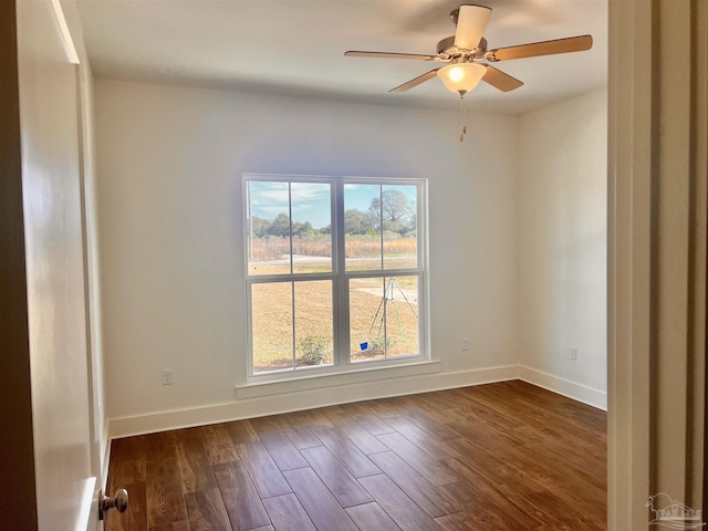 4420 Russell Elliott Rd, Jay, FL 32565 - unfurnished room with healthy amount of natural light, dark wood-style floors, ceiling fan, and baseboards