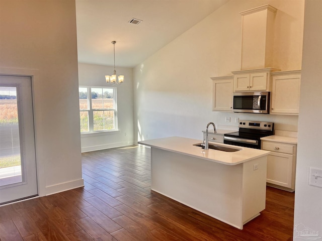 4420 Russell Elliott Rd, Jay, FL 32565 - kitchen featuring appliances with stainless steel finishes, a sink, dark wood finished floors, a chandelier, and light countertops