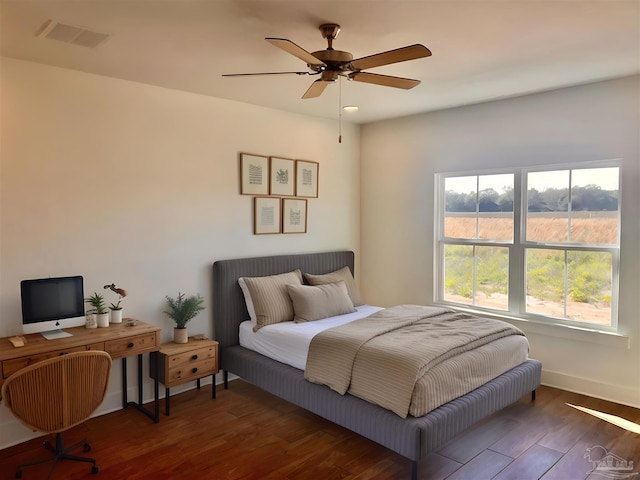 4420 Russell Elliott Rd, Jay, FL 32565 - bedroom with wood finished floors, baseboards, and a ceiling fan